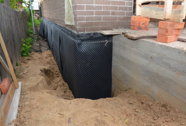 SJ Waterproofing Pros technician performing targeted Interior Drainage System assessment in Valders, WI